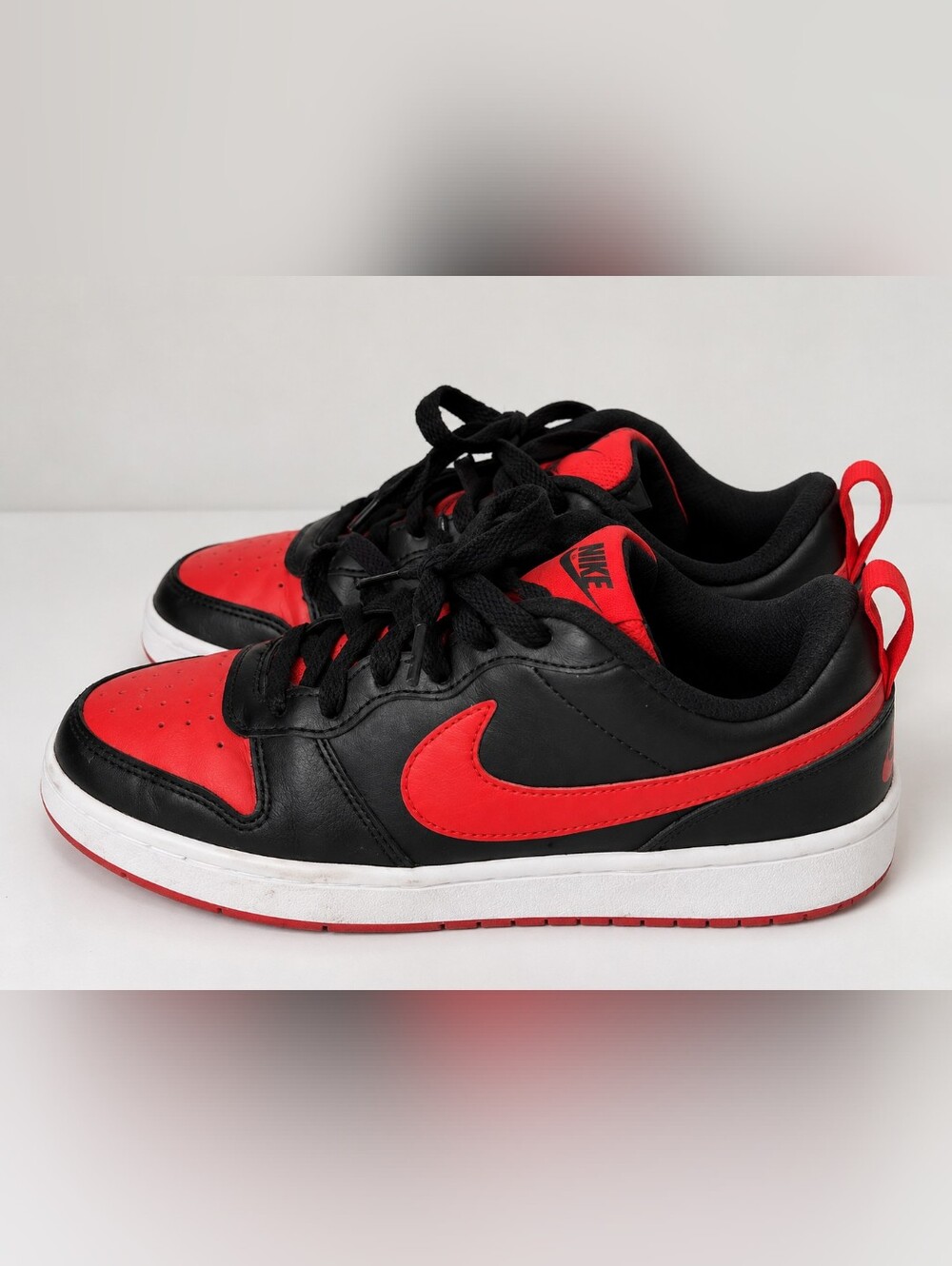 Nike Kids Black and Red Low-Top Sneakers with Swoosh